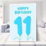 11th birthday card for boys shown in a living room