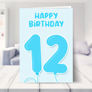 12th birthday card for boys shown in a living room
