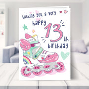 13th birthday card for girls shown in a living room