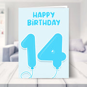 14th birthday card for boys shown in a living room