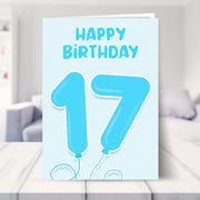 17th birthday card for boys shown in a living room