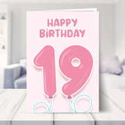 19th birthday cards for girl shown in a living room