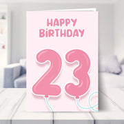 23rd birthday cards for her shown in a living room