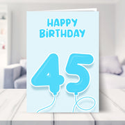 45th birthday card for him shown in a living room