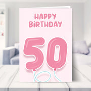 50th birthday cards for her shown in a living room