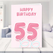 55th birthday cards for her shown in a living room
