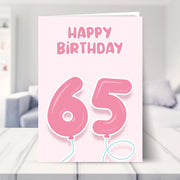 65th birthday cards for her shown in a living room