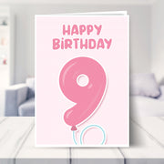 9th birthday card for girls shown in a living room