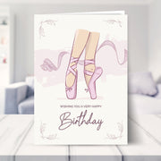 ballerina birthday card shown in a living room