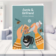 Auntie & Girlfriend christmas card shown in a living room