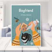 Boyfriend christmas card shown in a living room