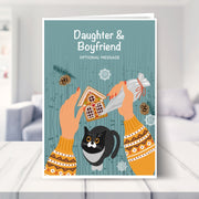 Daughter & Boyfriend christmas card shown in a living room