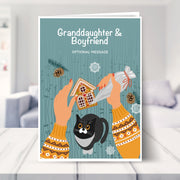 Granddaughter & Boyfriend christmas card shown in a living room
