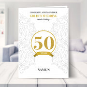 50th wedding anniversary card shown in a living room
