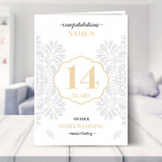 14th wedding anniversary card shown in a living room