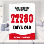 61st birthday card shown in a living room