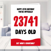 65th birthday card shown in a living room