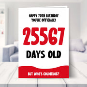 70th birthday card shown in a living room