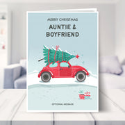 auntie and boyfriend christmas card shown in a living room