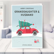 granddaughter and husband christmas card shown in a living room