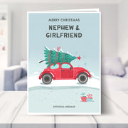 nephew and girlfriend christmas card shown in a living room