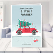 sister and partner christmas card shown in a living room
