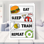 eat sleep trade repeat shown in a living room