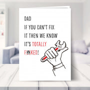funny fathers day card shown in a living room