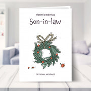 Son-in-law christmas card shown in a living room