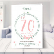 70th wedding anniversary card shown in a living room