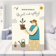gardening birthday card shown in a living room