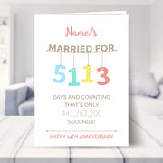 14th wedding anniversary card shown in a living room