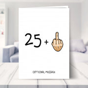 funny 26th birthday card shown in a living room