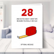funny 28th birthday card shown in a living room