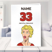 funny 33rd birthday card shown in a living room