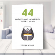 funny 44th birthday card shown in a living room