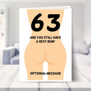 funny 63rd birthday card shown in a living room