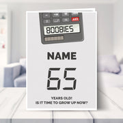 happy 65th birthday card shown in a living room