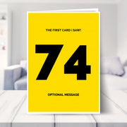 funny 74th birthday card shown in a living room