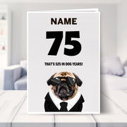 funny 75th birthday card shown in a living room