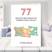 funny 77th birthday card shown in a living room