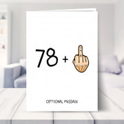 funny 79th birthday card shown in a living room