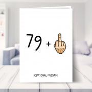 funny 80th birthday card shown in a living room