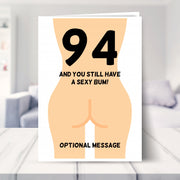 funny 94th birthday card shown in a living room