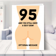 funny 95th birthday card shown in a living room