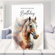 horse birthday card shown in a living room
