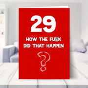 funny 29th birthday card shown in a living room