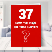 funny 37th birthday card shown in a living room
