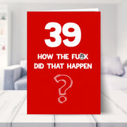 funny 39th birthday card shown in a living room