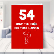 funny 54th birthday card shown in a living room